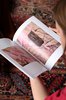 Chloe Stead flipping through a catalog by Roman Schramm; photo: Jens Franke