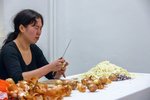 A woman peeling onions