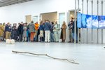 A stick is lying on the gallery floor.